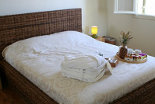 Χenon Estate villa Althea master bedroom rattan double bed