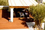 Xenon Estate luxurious resort swimming pool deck with a kiosk under a pergola