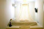 Luxury villas in Greece - Xenon Estate villa Lethe double bedroom concrete king size bed